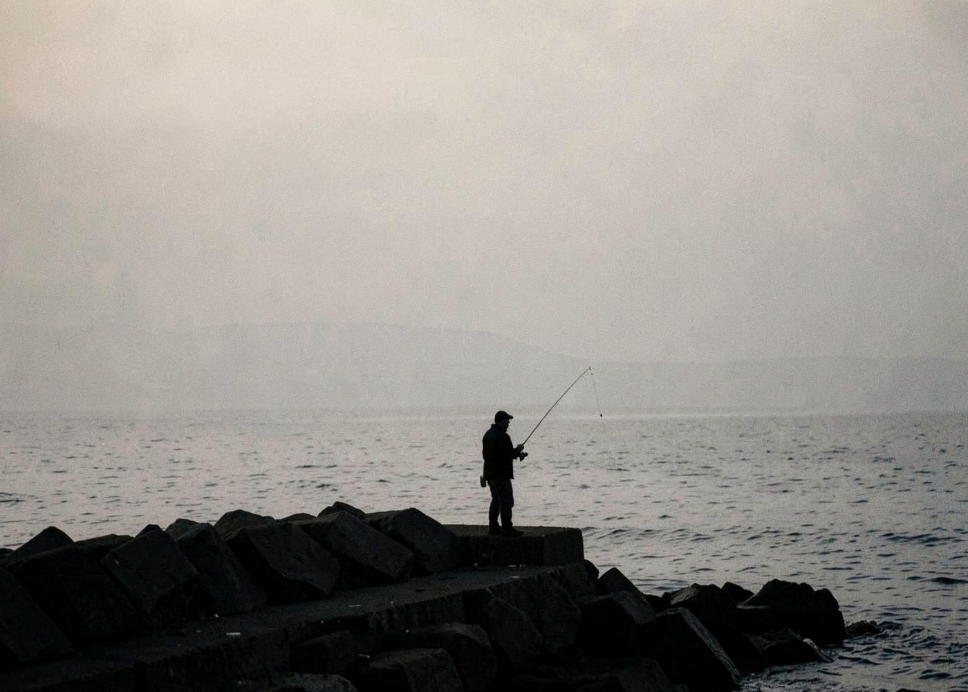 A rocky breakwater at dusk, a typical Light Game environment